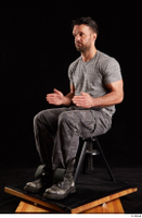  Larry Steel  1 boots dressed grey camo trousers grey t shirt shoes sitting whole body 0016.jpg